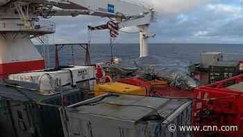 US Navy recovers wreckage of jet that crashed into aircraft carrier