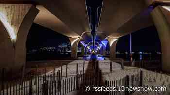 Blue and yellow lights shine on the Lesner Bridge in Virginia Beach to support Ukraine