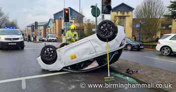 Solihull crash - Dramatic aftermath of two-car collision as white Vauxhall left on roof - Birmingham Live