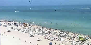 Video shows helicopter crash into the ocean just feet from Miami Beach shore