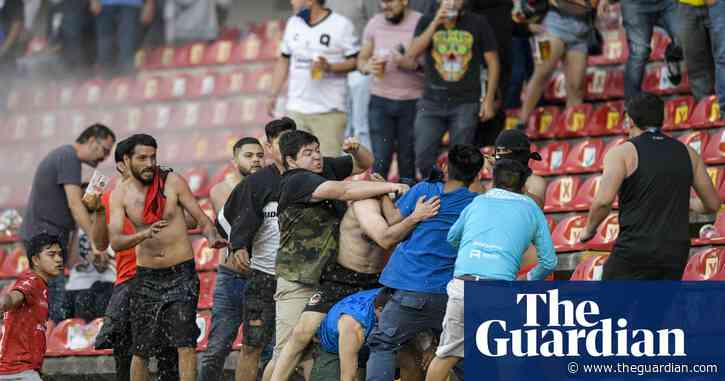 Liga MX suspended as Fifa condemns ‘barbaric’ riot that leaves dozens injured in Mexico