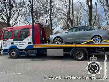 Uninsured Accrington driver runs red light and almost crashes with police car