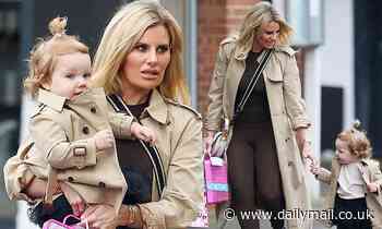 Danielle Armstrong looks effortlessly chic as she matches her Burberry trench with daughter Orla - Daily Mail