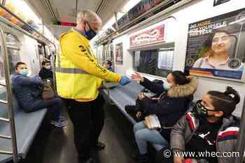 US extends mask rule for travel while weighing new approach