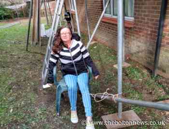 Bolton teacher ties herself to scaffolding in heating system protest - The Bolton News