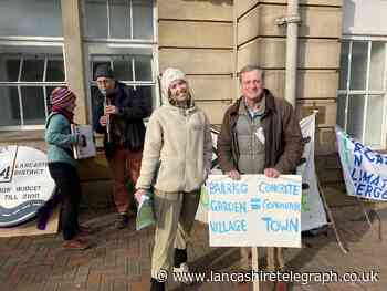Protesters gather at council's first climate summit to oppose 9,000 new homes plan
