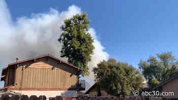 Firefighters battle large apartment fire in central Fresno