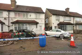 A406 North Circular: Pedestrian dies after car crashes into house