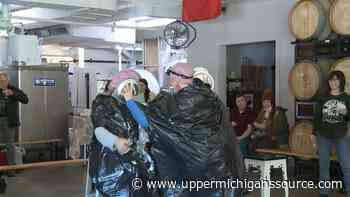 Pie throw donation drive at Barrel and Beam - WLUC