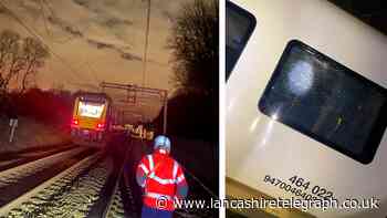 Log thrown onto railway tracks causes smashed window and fire onboard train