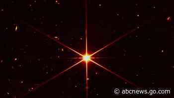 Space telescope's image of star gets photobombed by galaxies