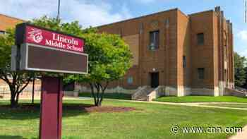 Off-duty officer put his knee on a 12-year-old's neck for more than 20 seconds while breaking up school fight, video shows
