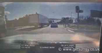 Police dash cam shows lorry narrowly avoid hitting car while changing lanes - Surrey Live