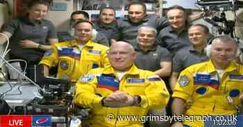 Russian cosmonauts wear Ukraine colours to International Space Station - Grimsby Live