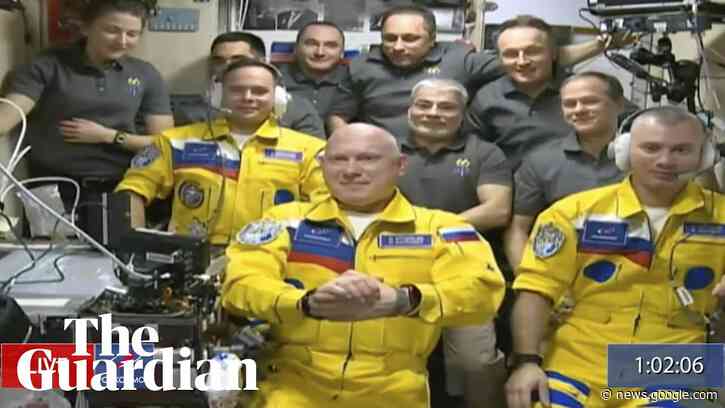 Russian cosmonauts board ISS wearing colours of Ukraine flag - Guardian News