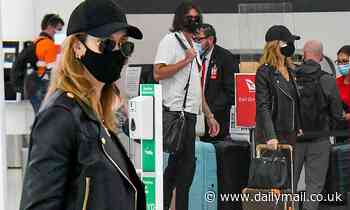 Delta Goodrem goes incognito at Sydney Airport with boyfriend Matt Copley - Daily Mail