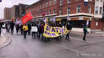 Demonstrators march in downtown Ottawa for migrants, refugees - CBC.ca