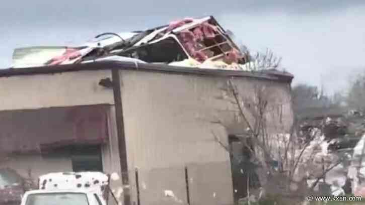 What happened to mobile home a tornado threw atop building in Elgin?