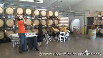 Barrel and Beam hosts paper plane event - WLUC