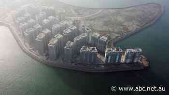 Evergrande says it is on track to restructuring after shares suspended and billions seized by banks