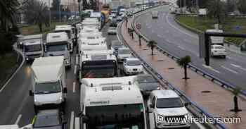 Spain agrees $551 mln transport aid package but trucker strike to continue - Reuters.com
