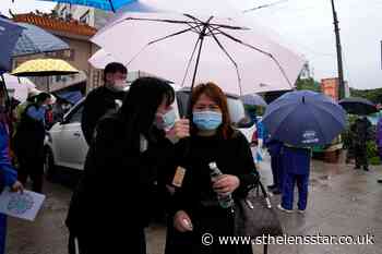 Search at China plane crash site suspended amid rain - St Helens Star