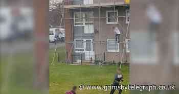 Anger as children climb and swing off scaffolding like 'wild animals' - Grimsby Live