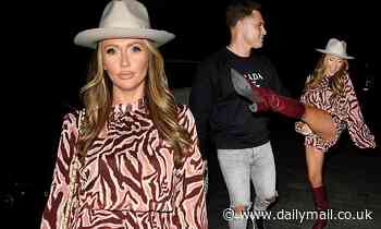 Charlotte Dawson puts on a VERY leggy display in a tiger print play-suit frolicing for the camera - Daily Mail