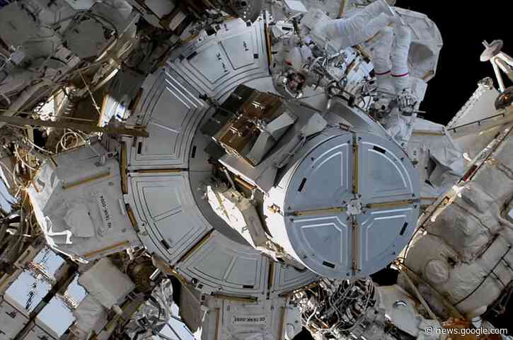 Spacewalking astronauts restore radiator, replace space station camera after wardrobe malfunction - Space.com