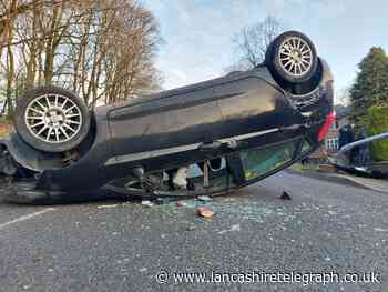 One lane closed as car overturns following collision in Blackburn
