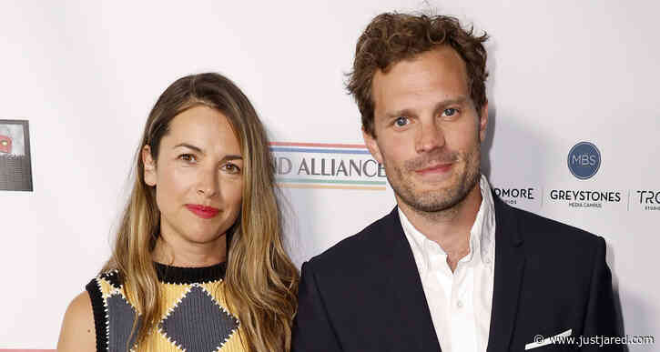 Jamie Dornan & Wife Amelia Warner Keep Close While Arriving at Oscar Wilde Awards 2022