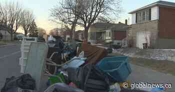 City steps in to clean up garbage pile on residential Dorval street - Global News