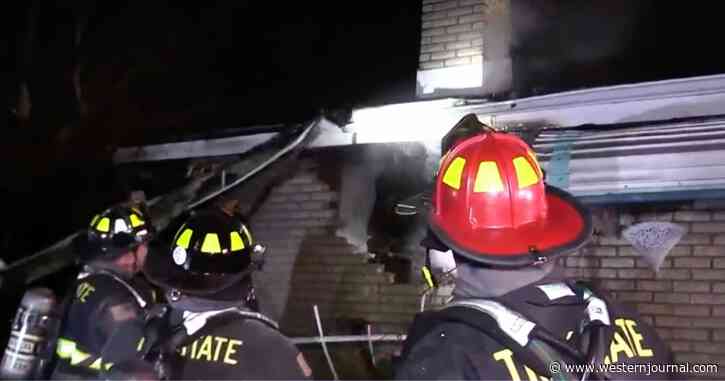 Police Officers Rush to Save Elderly Woman Trapped on Second Floor of Burning House