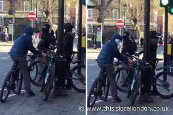 Greenwich: WATCH as cyclists attempt to saw off lock using angle grinder