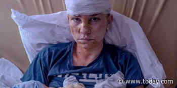 Photographer’s haunting photo shows Ukrainian mom who shielded her baby from a missile