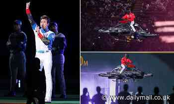 Manager of Japanese baseball team enters stadium on a flying MOTORBIKE