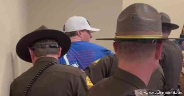 Crowd Erupts as Man in 'We the People' Shirt Is Thrown in Handcuffs, Hauled Out of State Senate Meeting