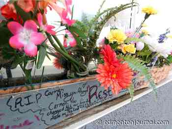 Flowers, notes placed outside slain Edmonton landlord's business