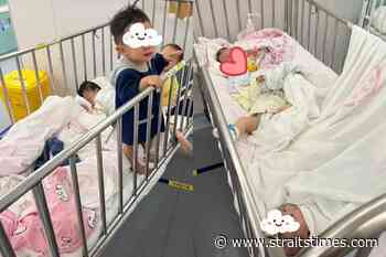 Shanghai separates Covid-positive children from parents in coronavirus fight - The Straits Times