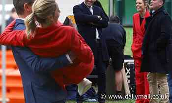Injured Today host Allison Langdon is carried across the MCG by a producer - Daily Mail