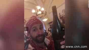 Man photographed 'chugging wine' in the US Capitol on January 6 sentenced to jail time