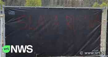 Werfdoeken aan nooddorp in aanbouw in Antwerpen beklad met pro-Russische slogan - VRT NWS
