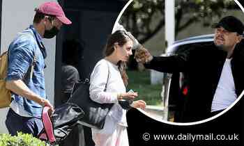 Mila Kunis bumps fists with Leonardo DiCaprio as she and Ashton Kutcher run into the A-lister - Daily Mail