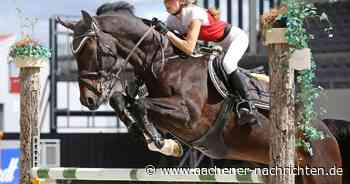 Springturnier in Aachen: Springreiter unter Flutlicht im Dressurstadion - Aachener Nachrichten