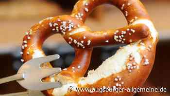 Stadtwerke verteilen Brezen und Studentenfutter an Fahrgäste