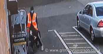 CCTV shows shocking moment cyclist steals ladders from Grimsby decorating shop - Grimsby Live