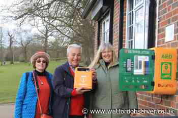 Defibrillator installed on café wall in Bushey park