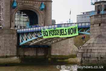 Extinction Rebellion activists abseil off Tower Bridge in climate protest - Dudley News