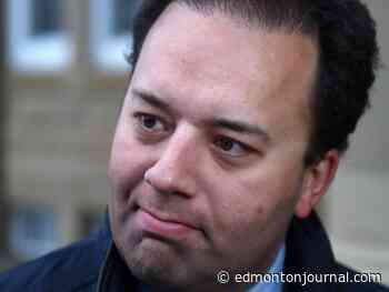 Former Alberta Justice minister accused of interfering in ex-medical examiner's wrongful dismissal trial