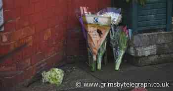 Woman named as floral tributes laid at house following 'unexplained' death - Grimsby Live